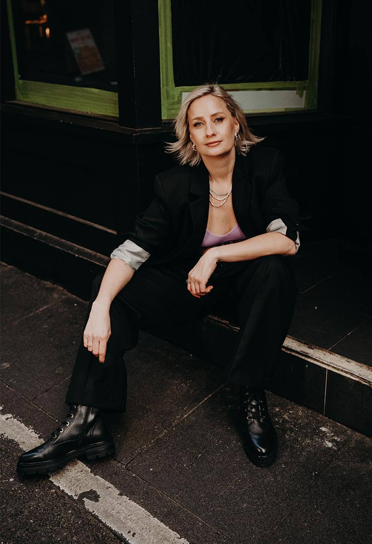 Australian OBM mentor Cat Dunn, sitting at a cafe in Melbourne.