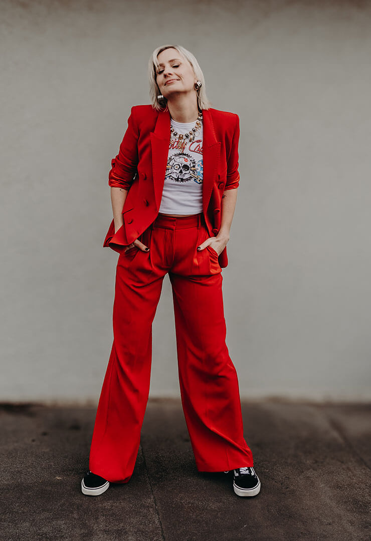 OBM Cat Dunn, wearing a red suit in Melbourne to meet with a client.